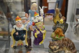 A collection of Doulton, Beswick and other porcelain figures relating to Alice in Wonderland.