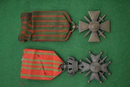 Two military medals.