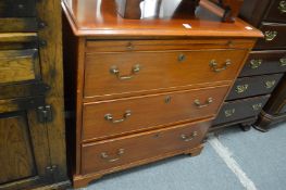 A mahogany three drawer chest with brushing slide.