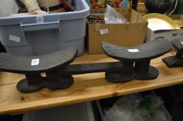 An African carved wood double double head rest.