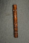 A New Zealand carved wood totem.