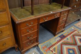A Victorian walnut pedestal desk.