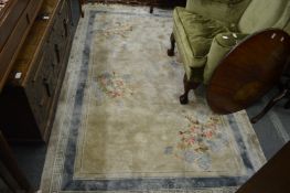 A floral decorated Chinese carpet 250cm x 150cm.