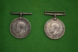 Two WWI medals, one name Private T W Major Army Service Corp, the other Private J Smith Highland