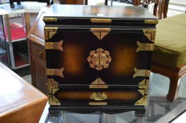 A small Chinese table top cabinet.