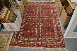 Persian rug, red ground with stylised decoration 200cm x 130cm.