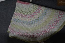 A colourful mat, a tapestry making frame and three mirrors.