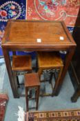 A Chinese hardwood occasional table and set of four small similar tables.