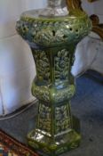 A green glazed pottery jardiniere stand.