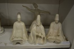 A group of four unusual white glazed pottery figures of musicians.
