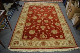 Modern carpet, red ground with stylised floral and leaf decoration 250cm x 170cm.
