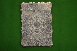 An engraved silver calling card case.