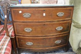 A 19th century mahogany bow front three drawer chest.