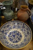 A large blue and white bowl, jug, vase and brass lamp base.
