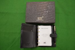 A Mont Blanc leather note case with propelling pencil, in original box with paperwork.