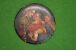 A small circular Limoge plaque depicting mother and child.