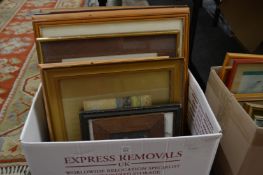 A box of paintings and prints.