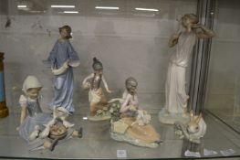 A collection of Lladro and Neo figures.