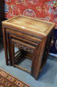A Chinese hardwood nest of four tables.
