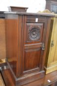 A Victorian walnut pot cupboard.
