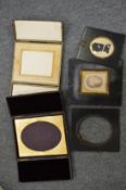 Leather folding photograph frames, a silhouette and other items.
