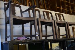 A set of four 1940's oak dining chairs, one with arms.