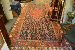 A good early 20th century Persian carpet, blue ground with stylised decoration 500cm x 210cm.