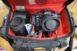 A Canon 35mm camera with accessories and numerous other photographic equipment.