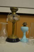Two oil lamps.