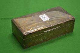 A plain silver cigarette box.