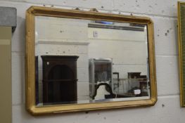 A gilt framed wall mirror.