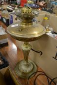 A brass oil lamp.