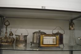Plated items to include a desk calendar, a part cruet set, biscuit barrels etc.