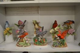 A collection of porcelain bird ornaments.