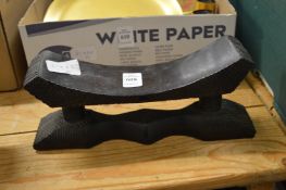 An African carved wood head rest.