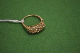 A 9ct gold dress ring.