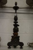 A bronze classical style lamp base.