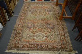 A Turkish part silk carpet with stylised floral decoration 265cm x 145cm.