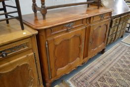 A good 19th century French cherry sideboard with two drawers and two panelled cupboard doors.