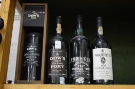Four bottles of vintage port comprising Dows 1966, Fonseca 1967, Warres 1980 and Dows 2004.