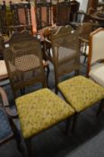 A pair of dining chairs.