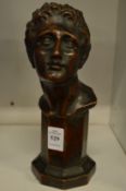 A After the Antique, a bronze style bust of a youth.