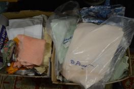 Two boxes of household linen.