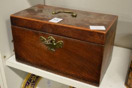A Georgian mahogany tea caddy.