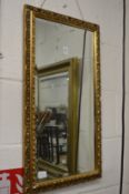 A small gilt framed mirror.