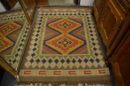 A Kilim style rug 180cm x 125cm.