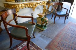 A good pair of Empire Revival mahogany and leather upholstered open armchairs.