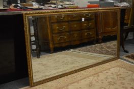 A gilt framed mirror.