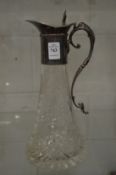 Cut glass claret jug with plated mounts.