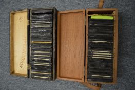 Two boxes containing early photographic slides.